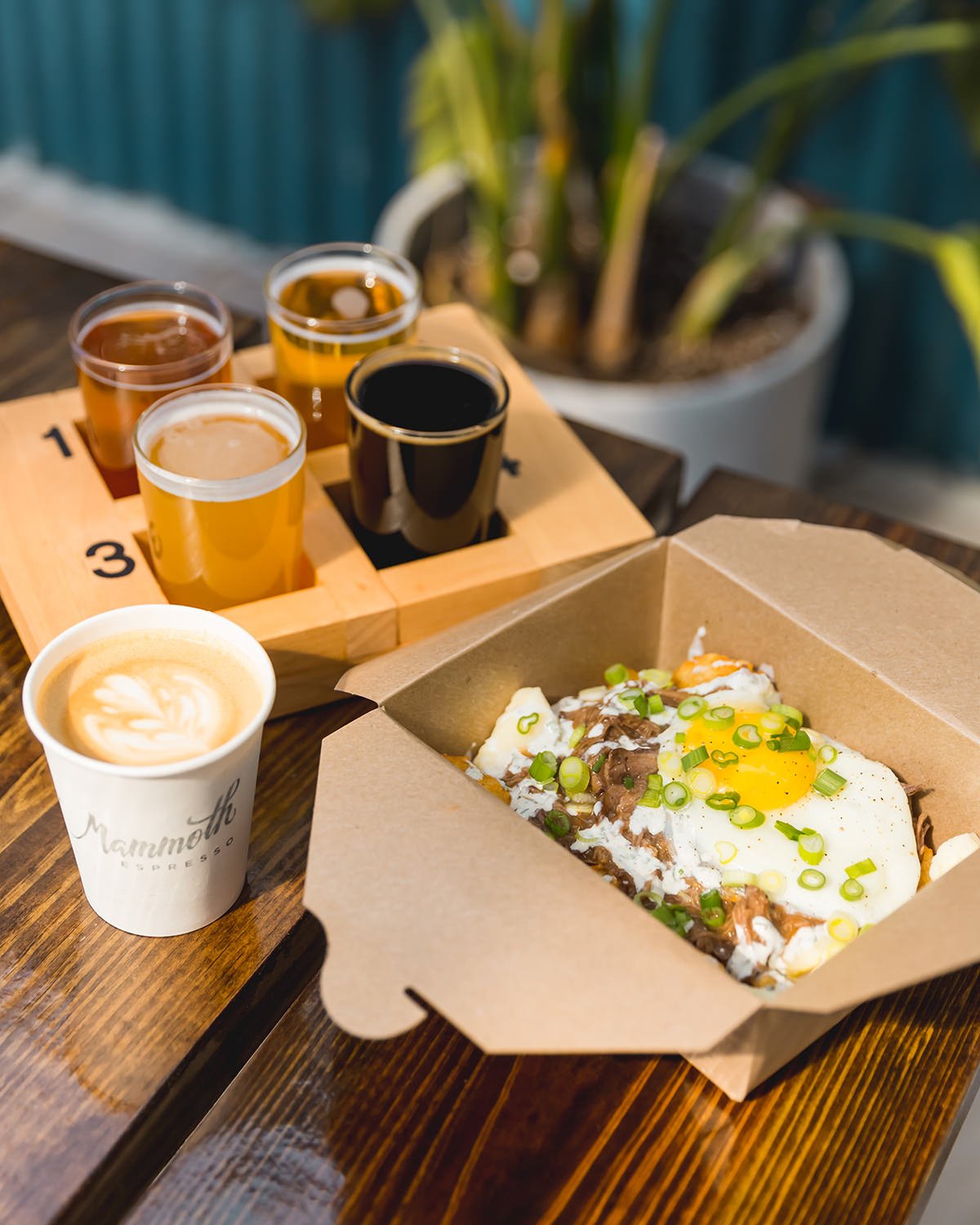 Breakfast Poutine from Hatch + Harvest, a Mammoth coffee, and a flight of Miel beer