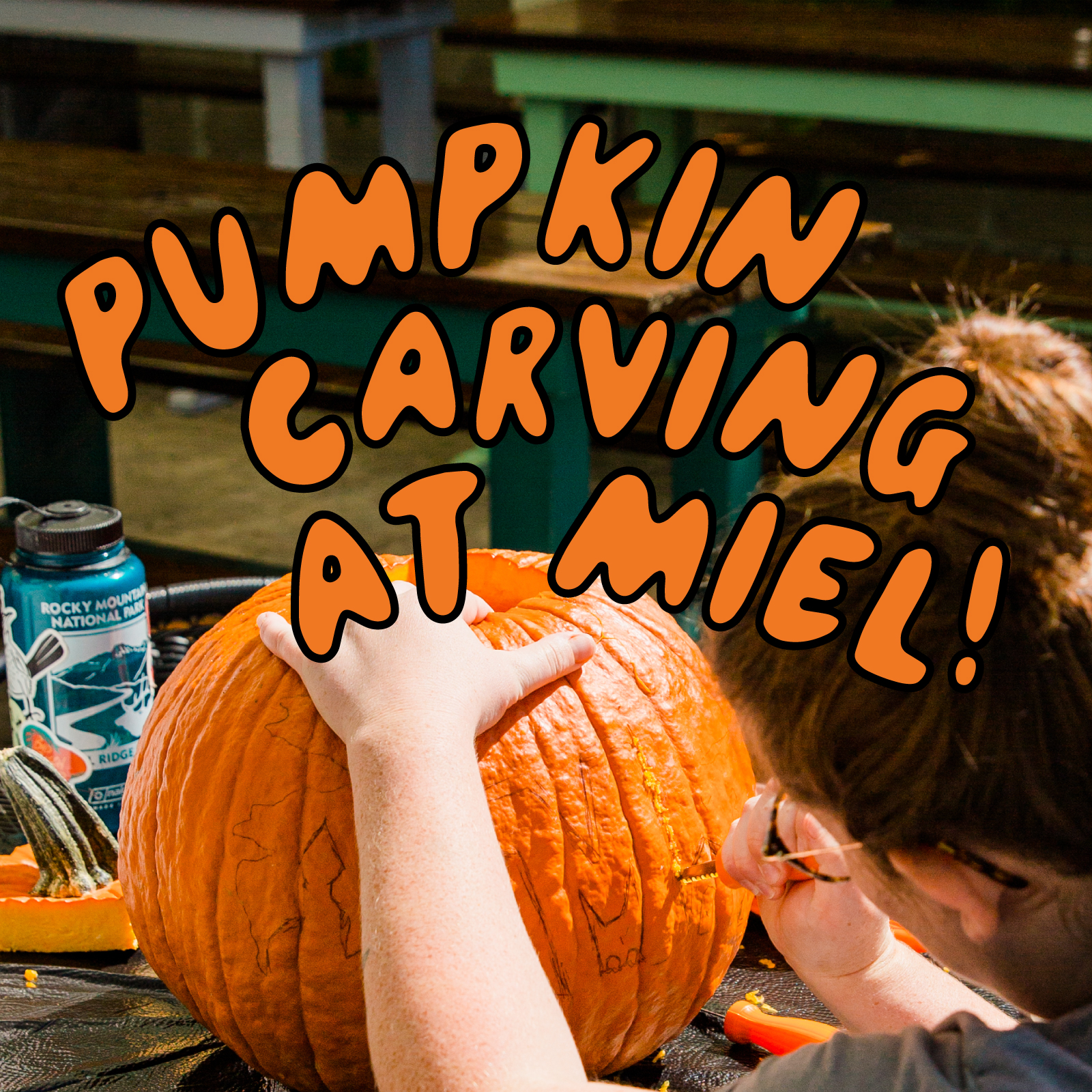 A pumpkin being carved with the text Pumpkin Carving at Miel