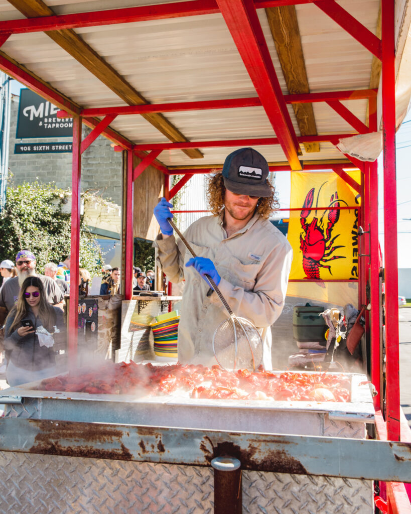 James of Mais La Seafood boiling crawfish at Miel Brewery