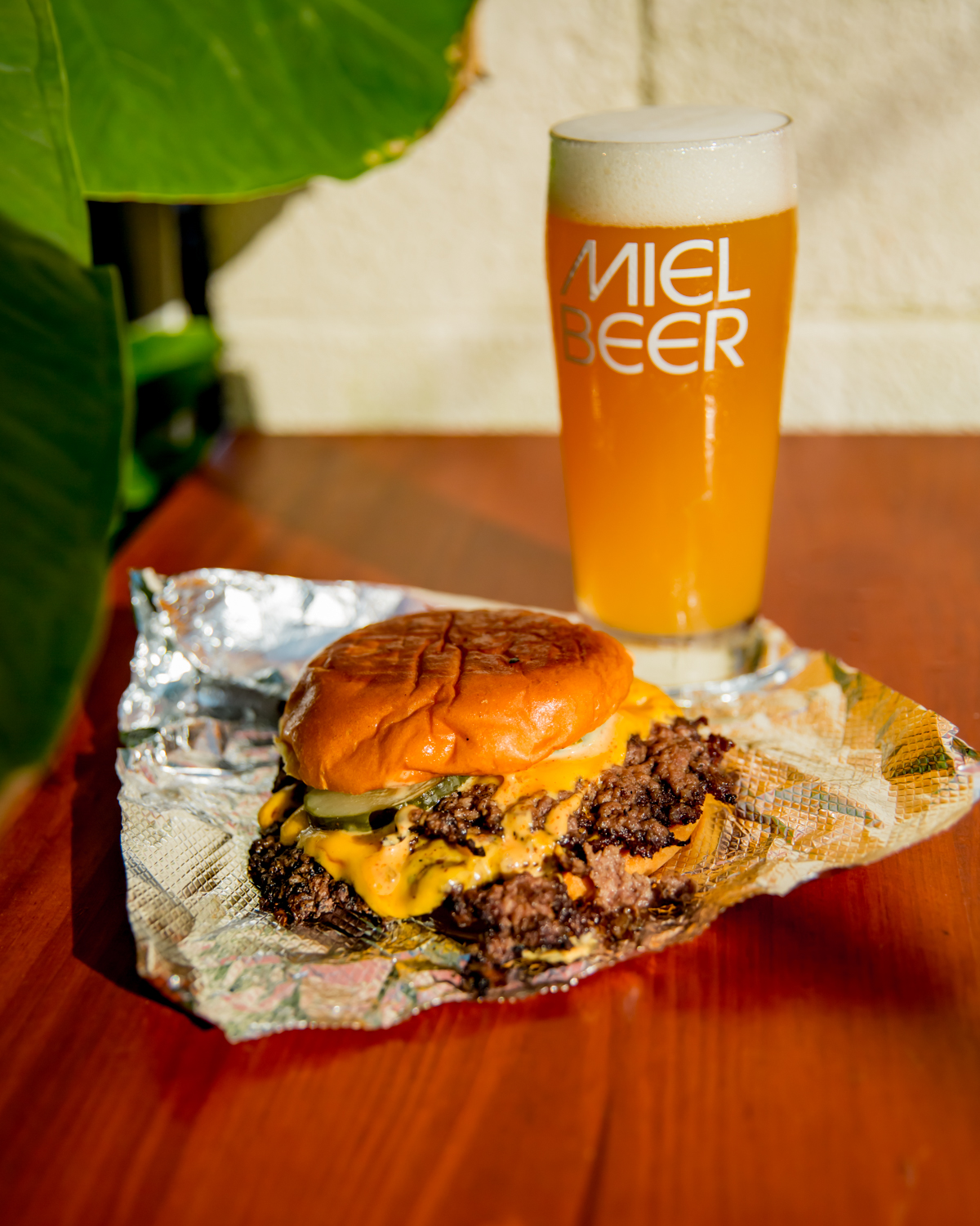 Coops smash burger with a Miel beer